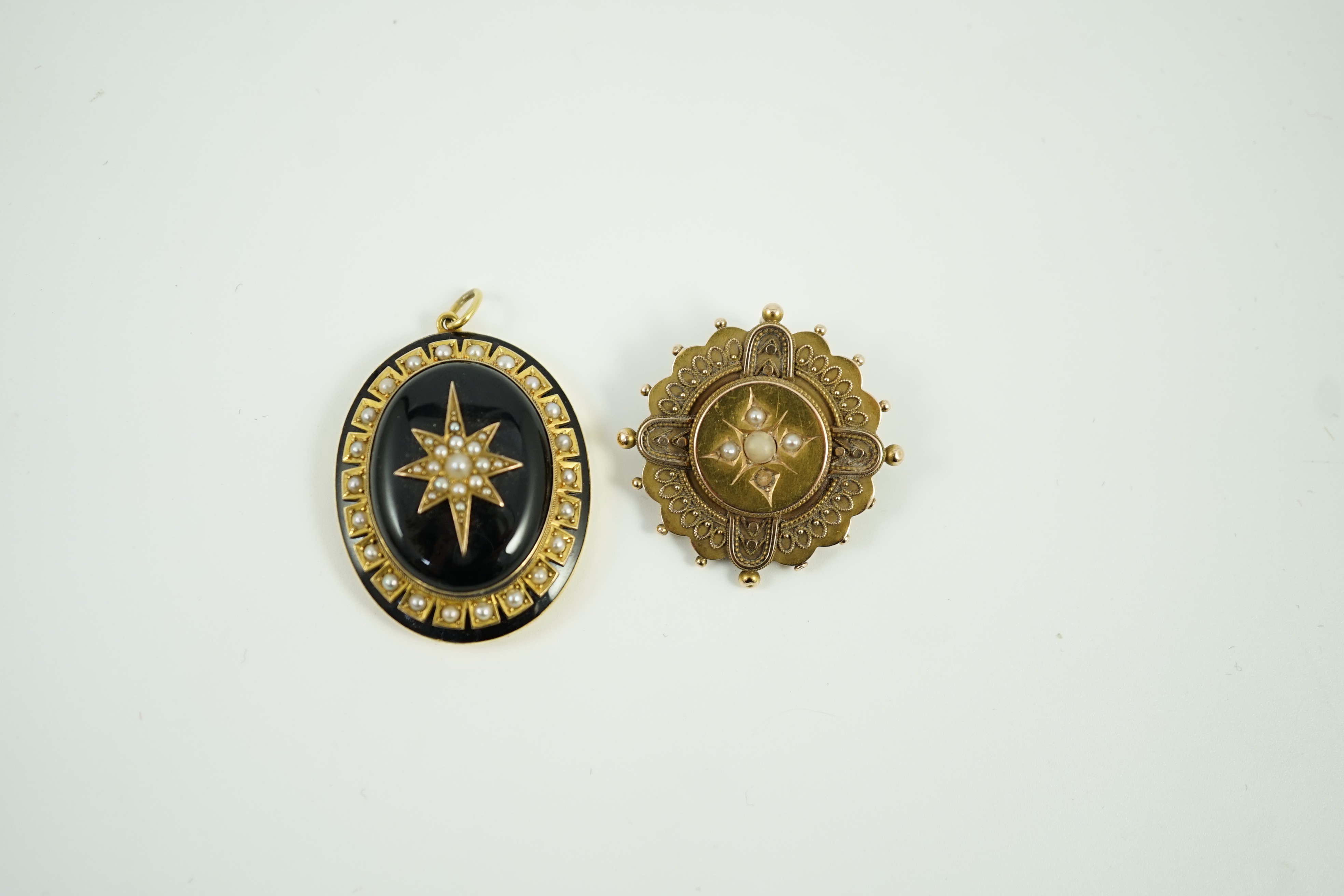 A Victorian yellow metal, black onyx, black enamel and split pearl set oval mourning pendant, 41mm and a Victorian 15ct, coral? and seed pearl set brooch, gross weight 21.5 grams.